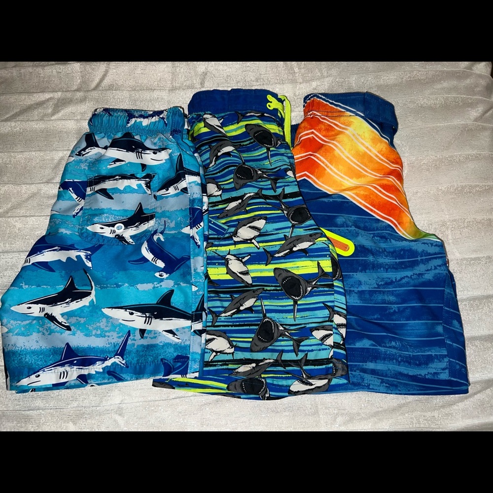 3 pair of NEW and like new boys size 8 swim trunks.